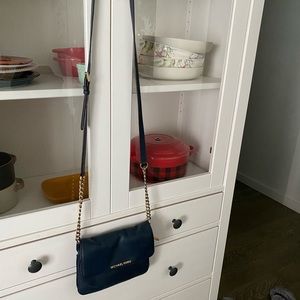 Michael Kors navy blue purse.